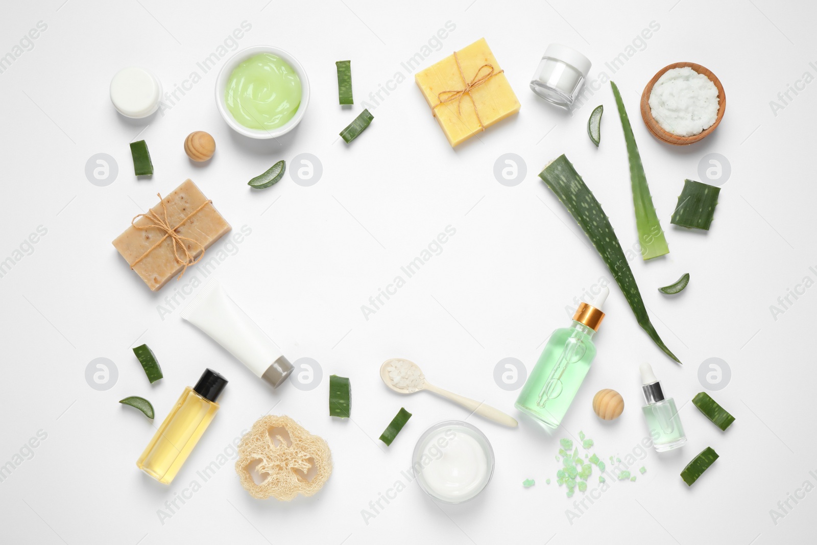 Photo of Flat lay composition with aloe vera and cosmetic products on white background. Space for text