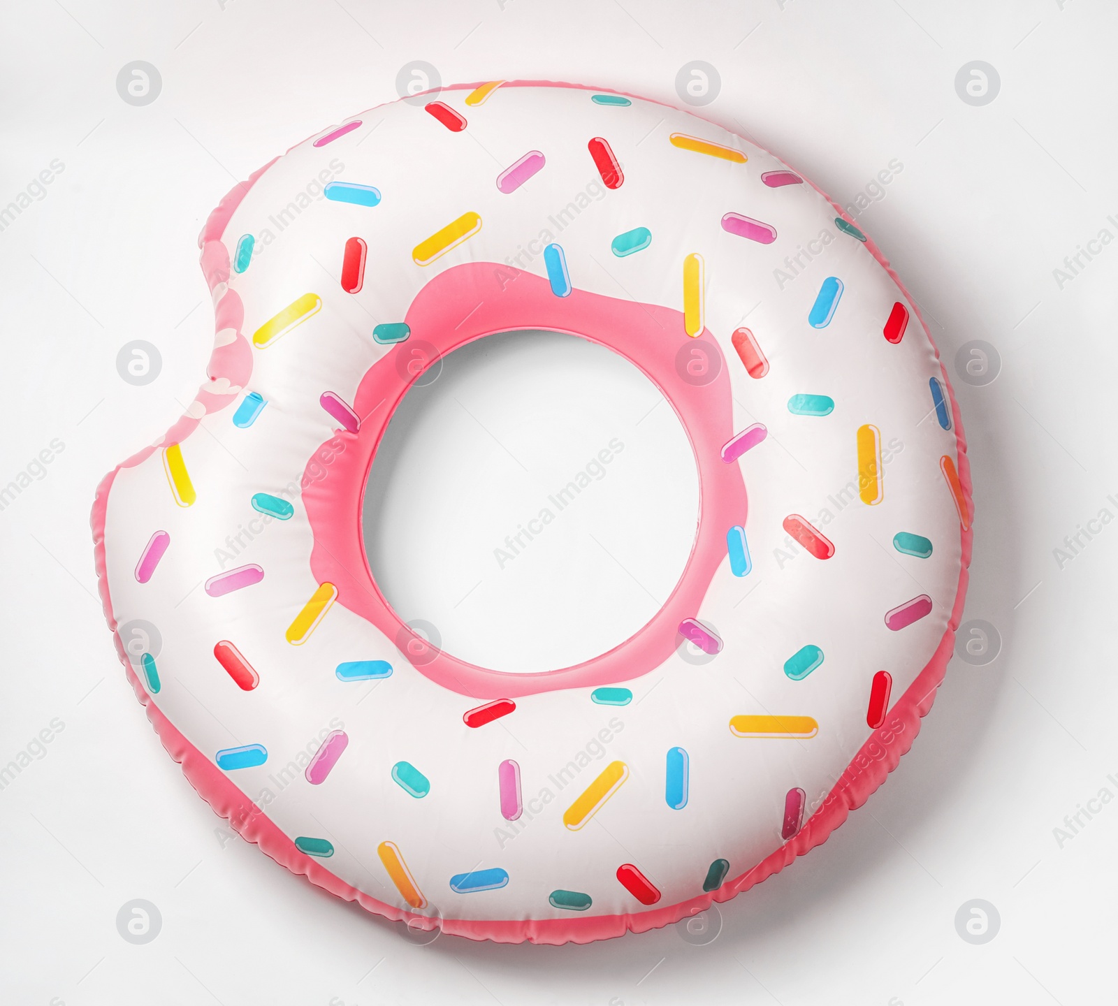 Photo of Bright inflatable donut on white background. Beach object