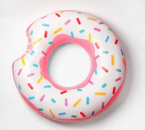 Bright inflatable donut on white background. Beach object