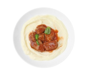 Photo of Delicious goulash with mashed potato isolated on white, top view