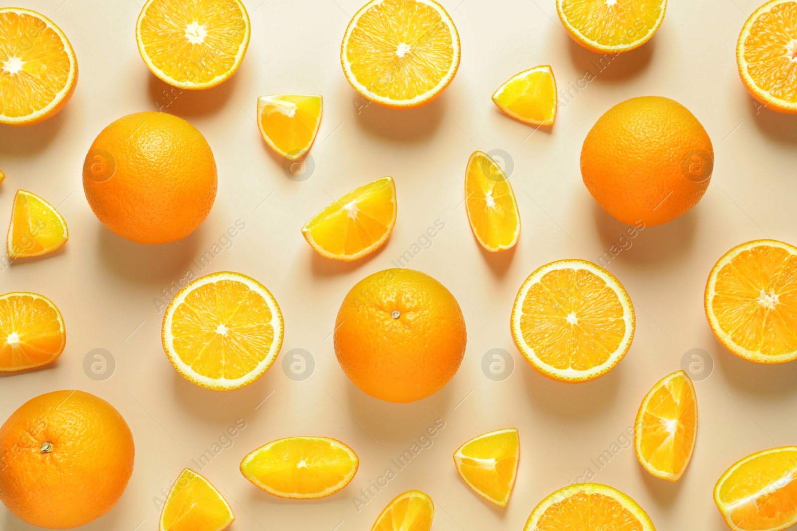 Photo of Flat lay composition with ripe oranges on color background