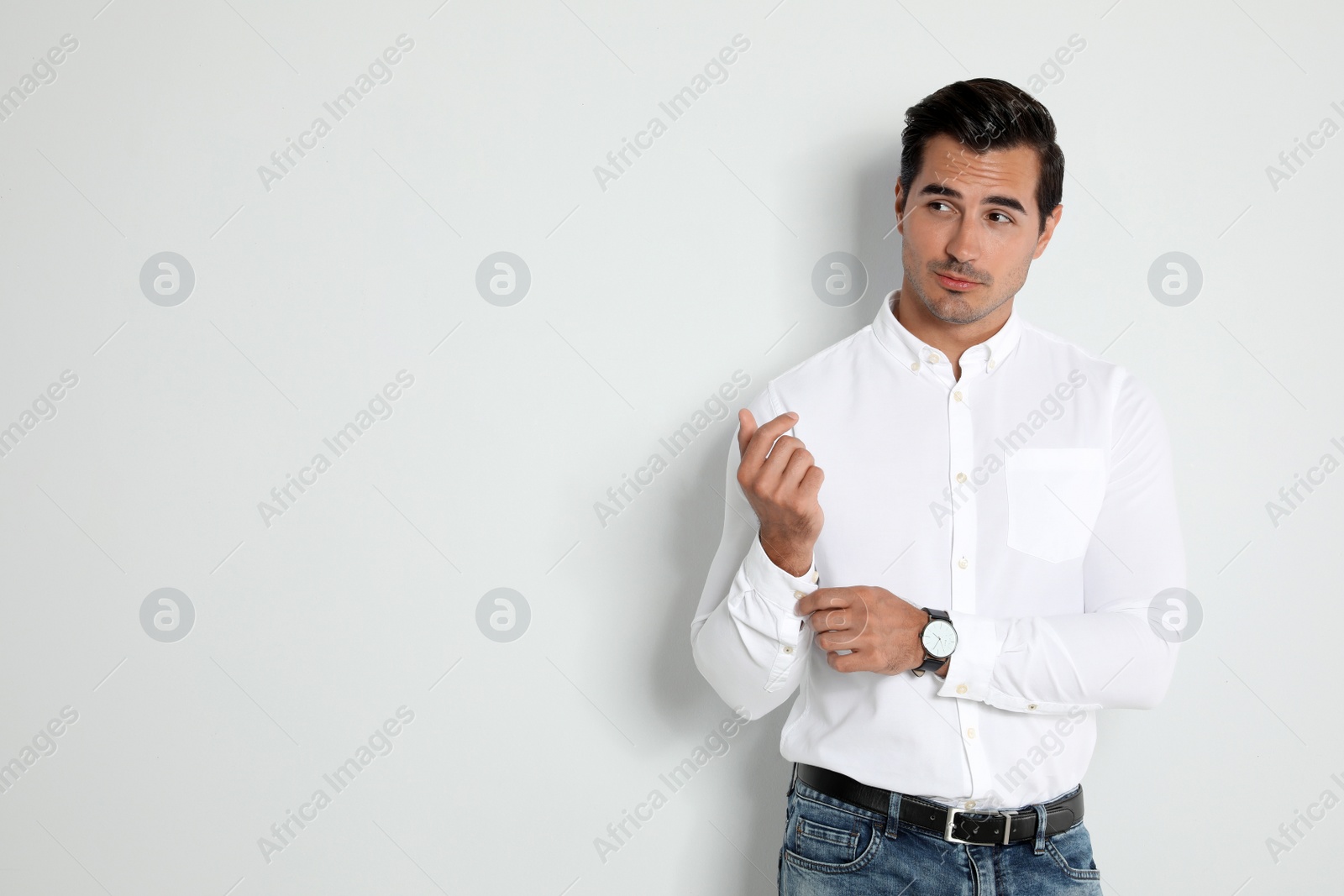 Photo of Portrait of handsome young man on light background. Space for text