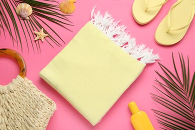 Photo of Flat lay composition with different beach objects on pink background