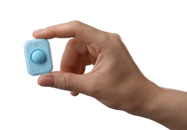 Woman holding water softener tablet on white background, closeup