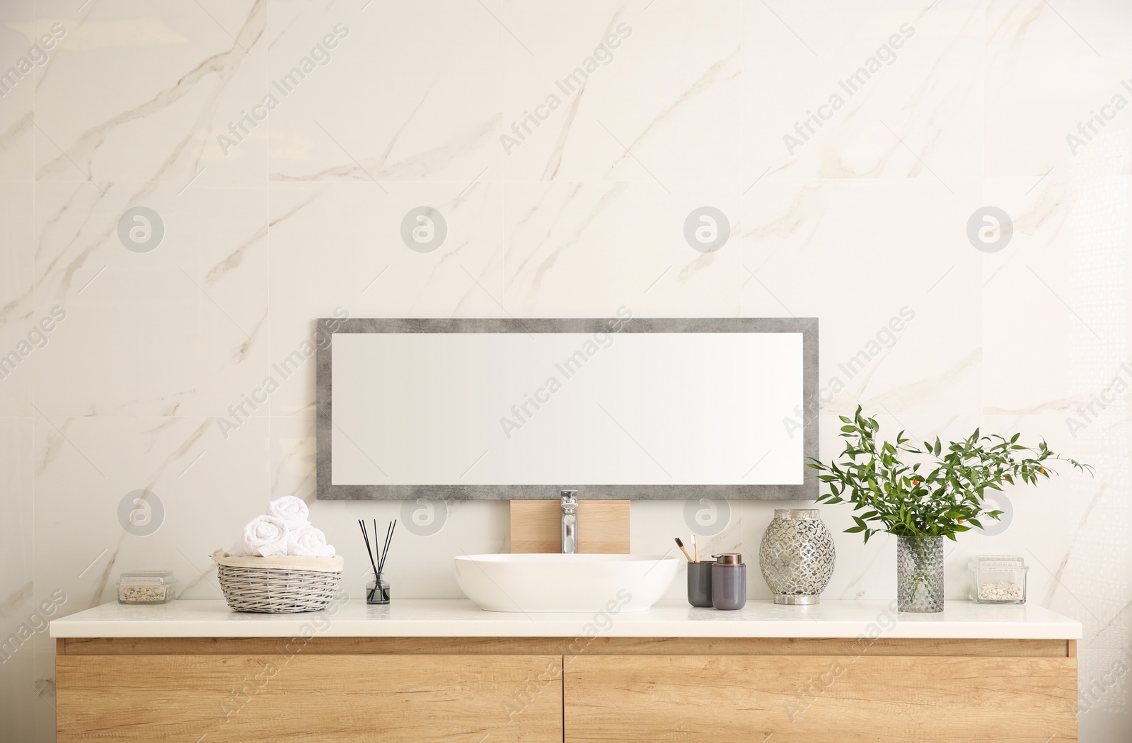 Photo of Modern bathroom interior with stylish mirror and vessel sink