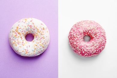 Photo of Delicious glazed doughnuts on color background, top view