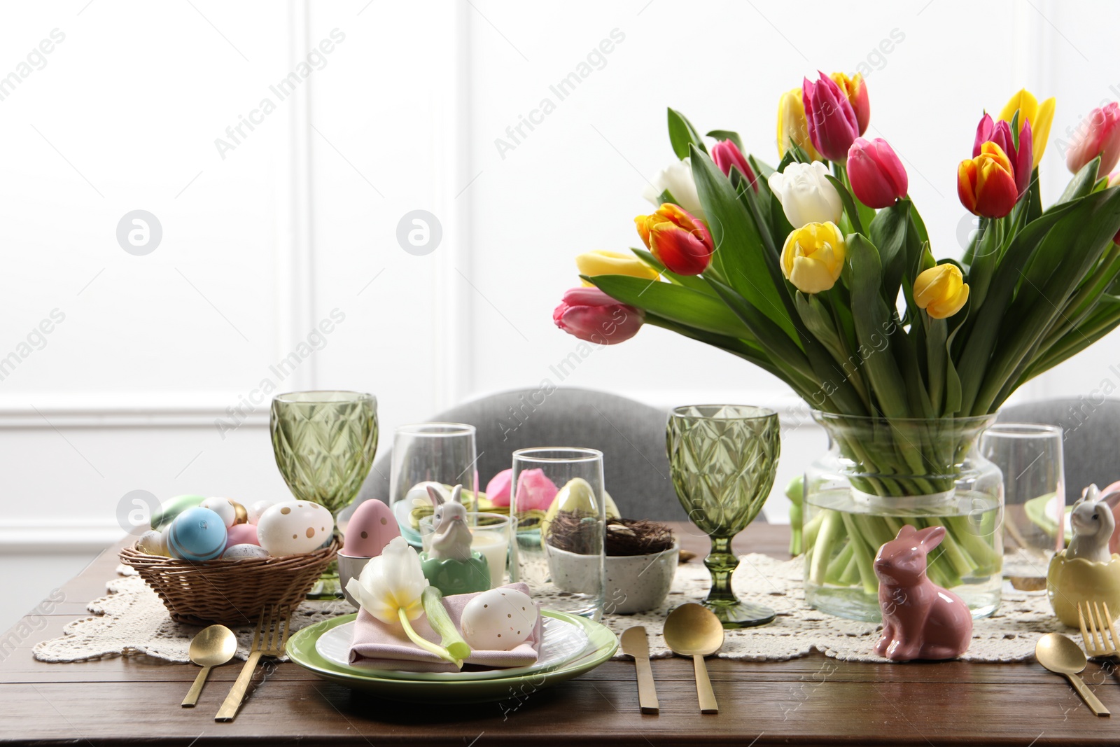 Photo of Festive table setting with beautiful flowers. Easter celebration