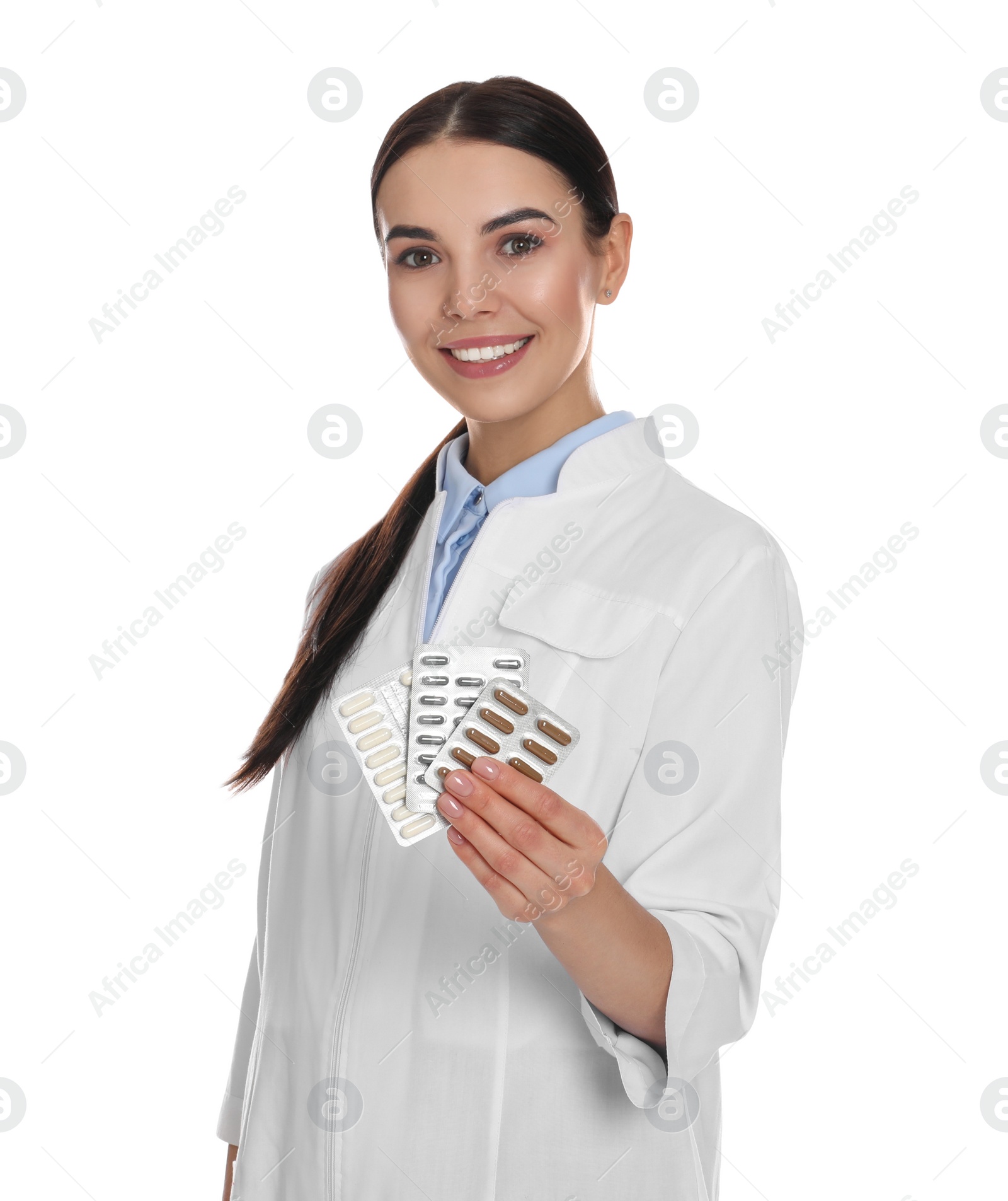 Photo of Professional pharmacist with pills on white background