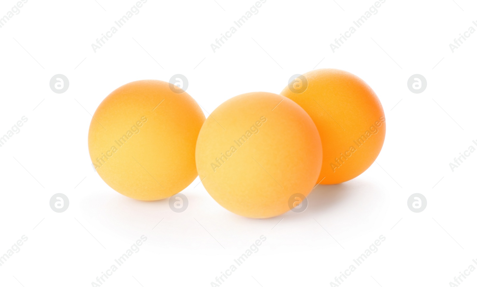 Photo of Orange ping pong balls isolated on white
