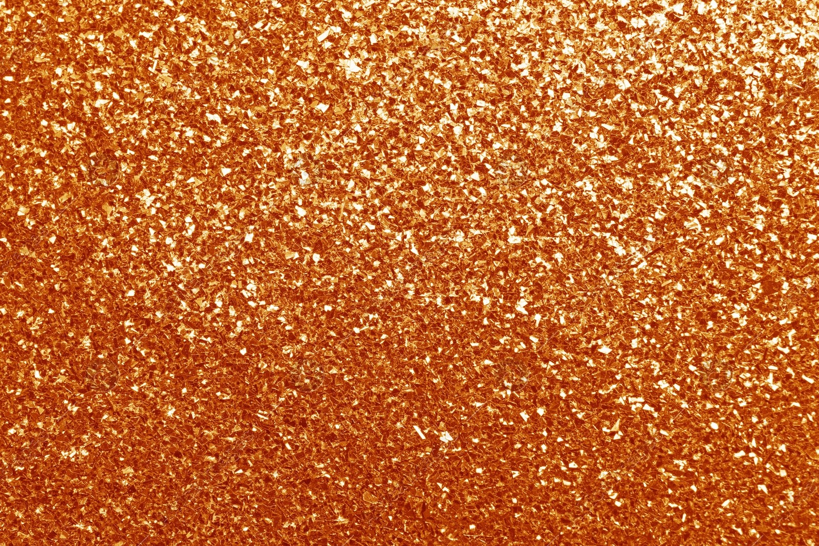 Image of Beautiful shiny orange glitter as background, closeup