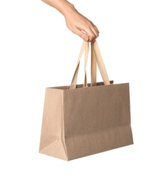 Woman holding paper shopping bag isolated on white, closeup