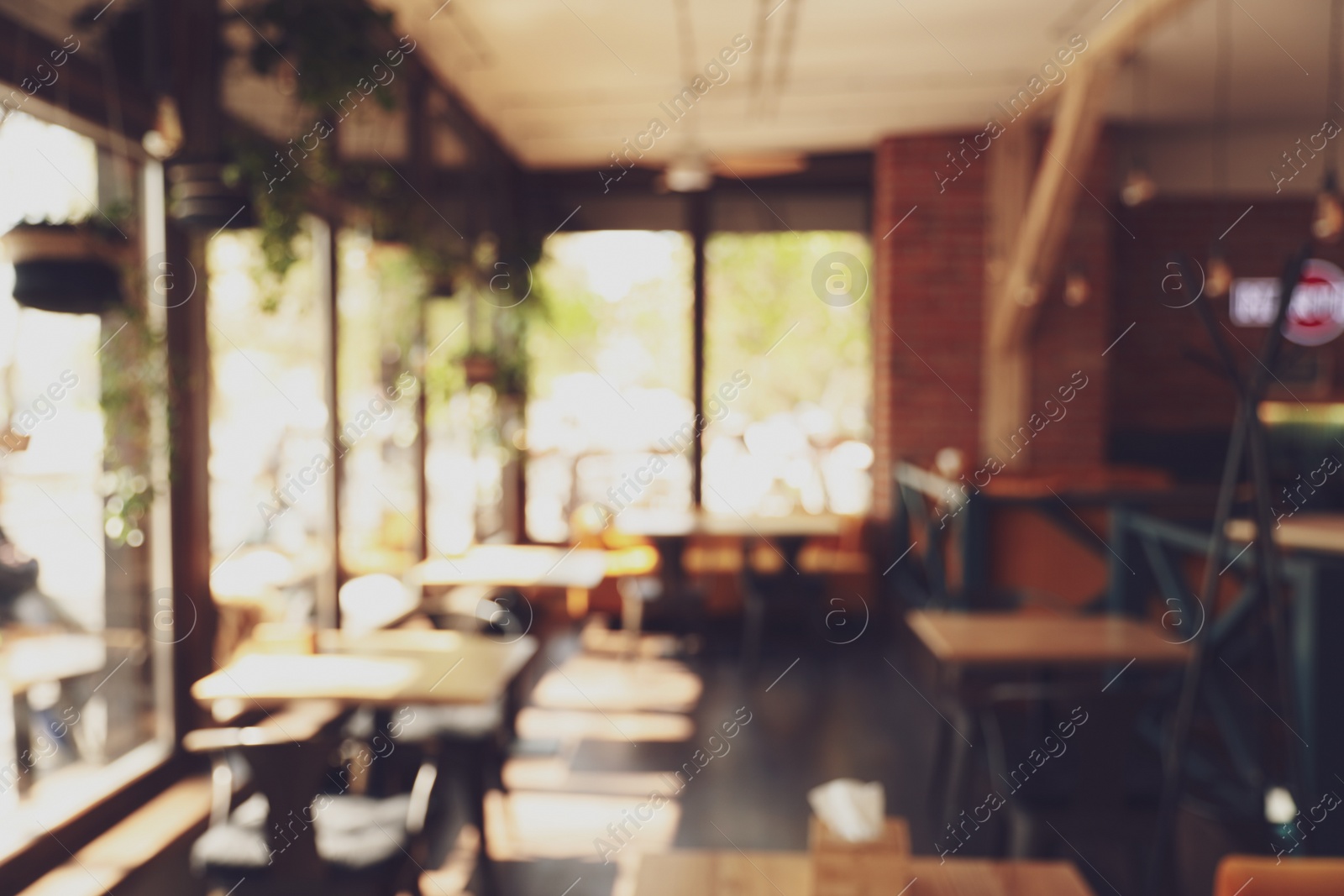 Photo of Blurred view of cafe interior with bokeh effect