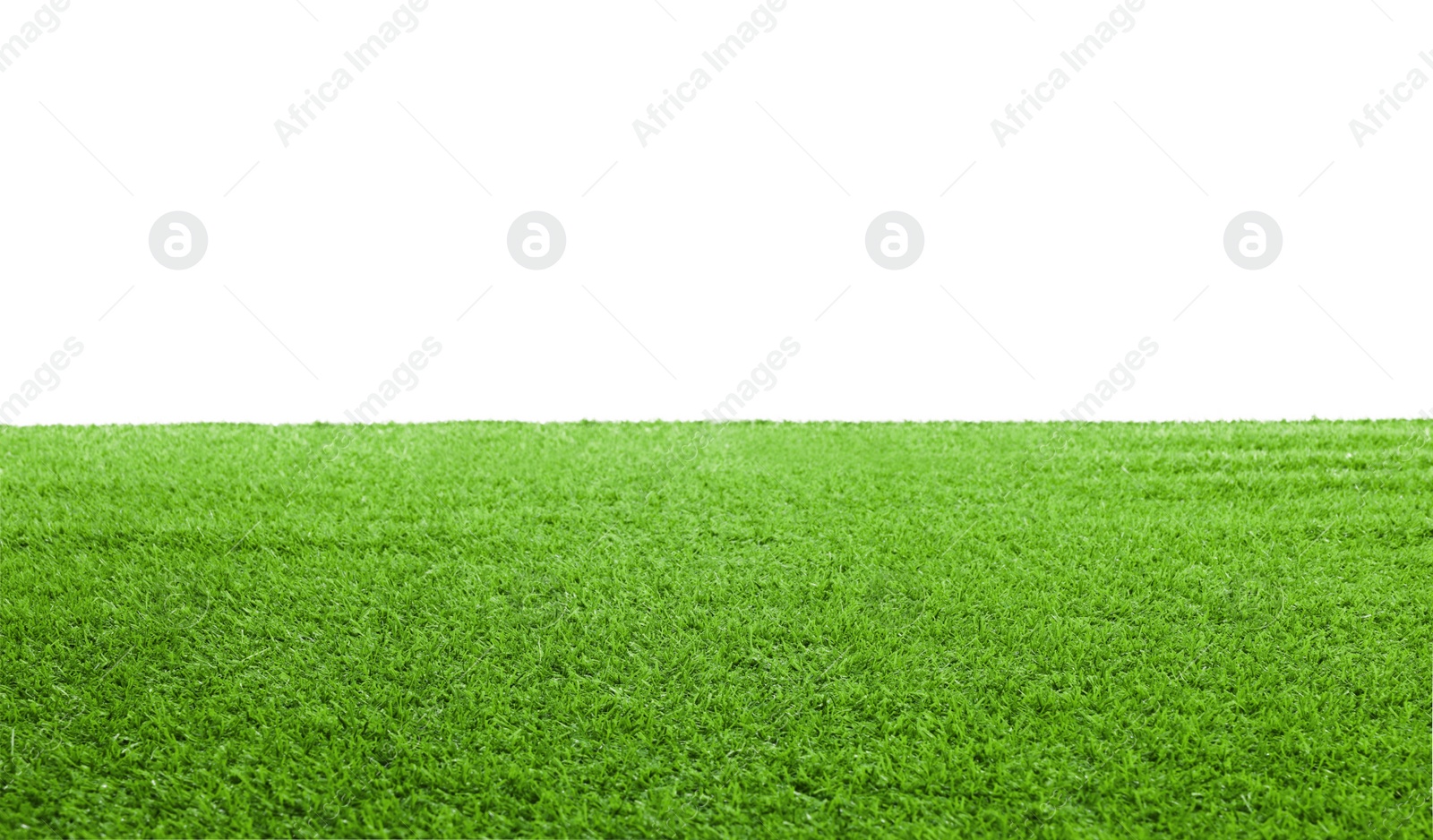 Photo of Green artificial grass surface isolated on white