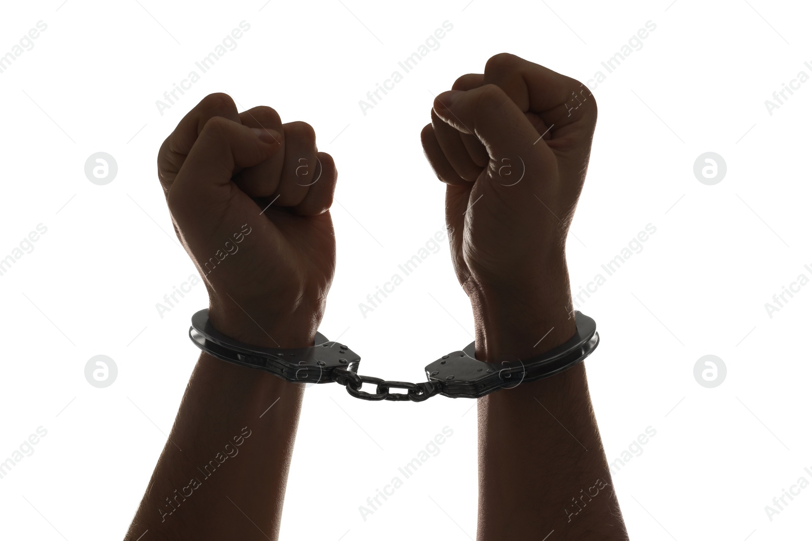 Photo of Freedom concept. Man with handcuffs on his hands against white background, closeup