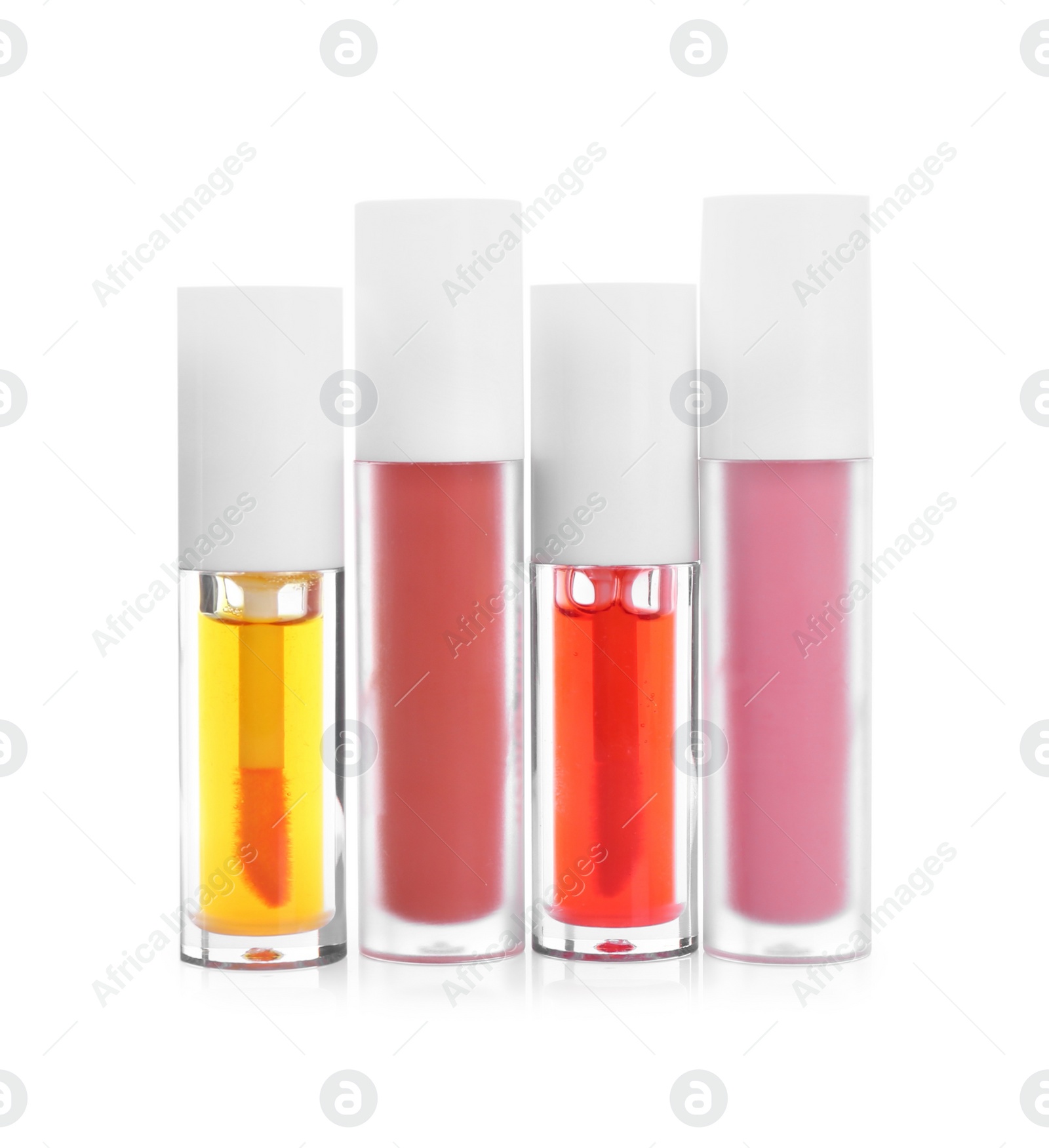 Photo of Many different lip glosses isolated on white