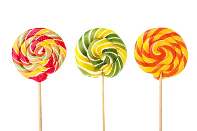 Different tasty colorful candies on white background