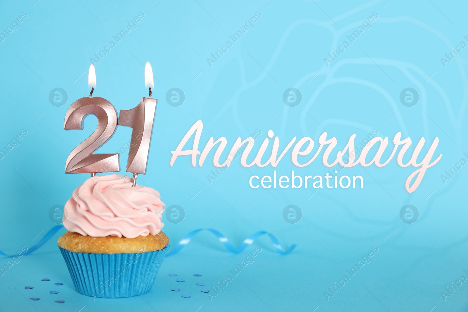Image of Delicious cupcake with number shaped candles on light blue background. Coming of age party - 21th birthday. Anniversary celebration