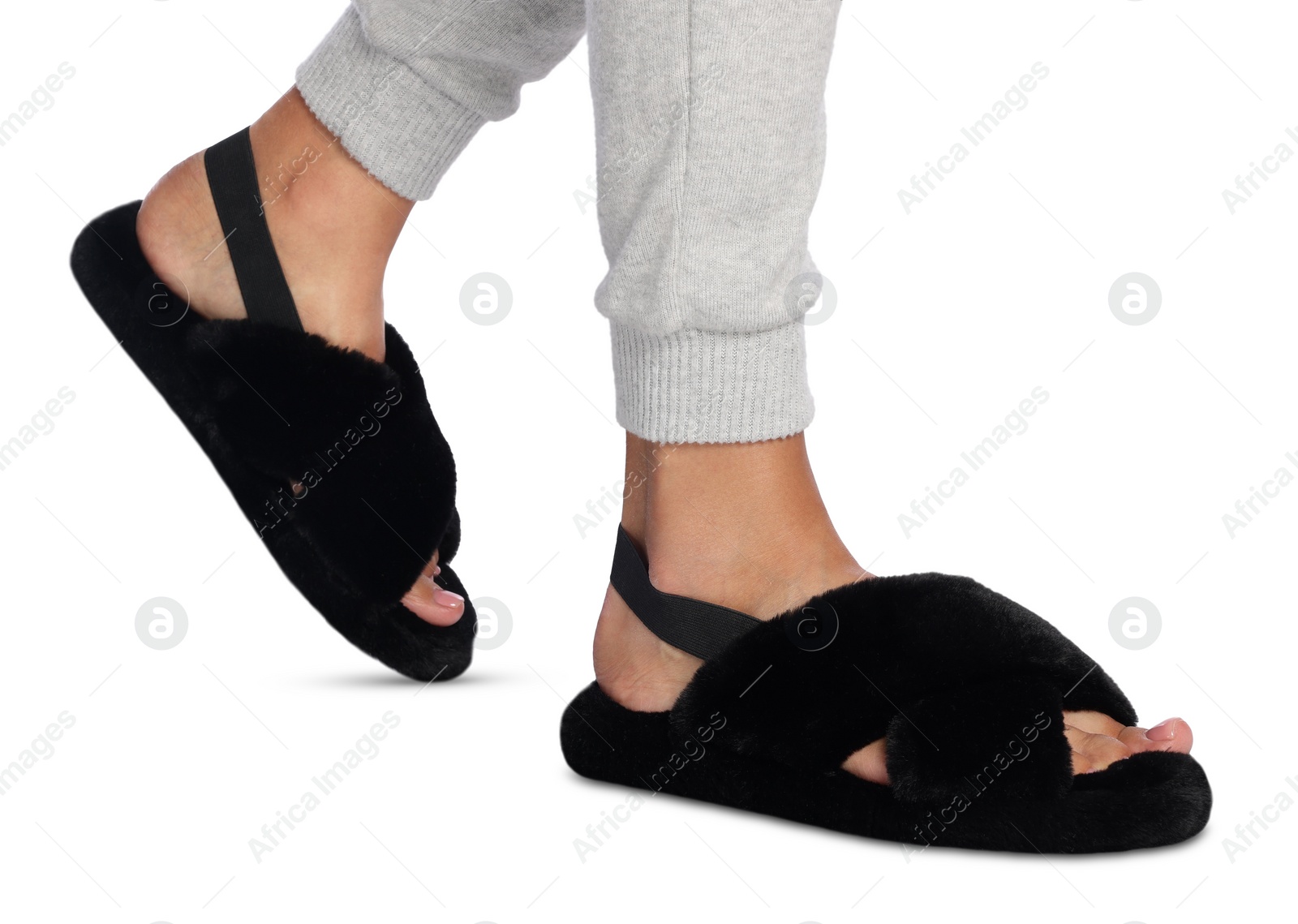 Photo of Woman in fluffy slippers on white background, closeup