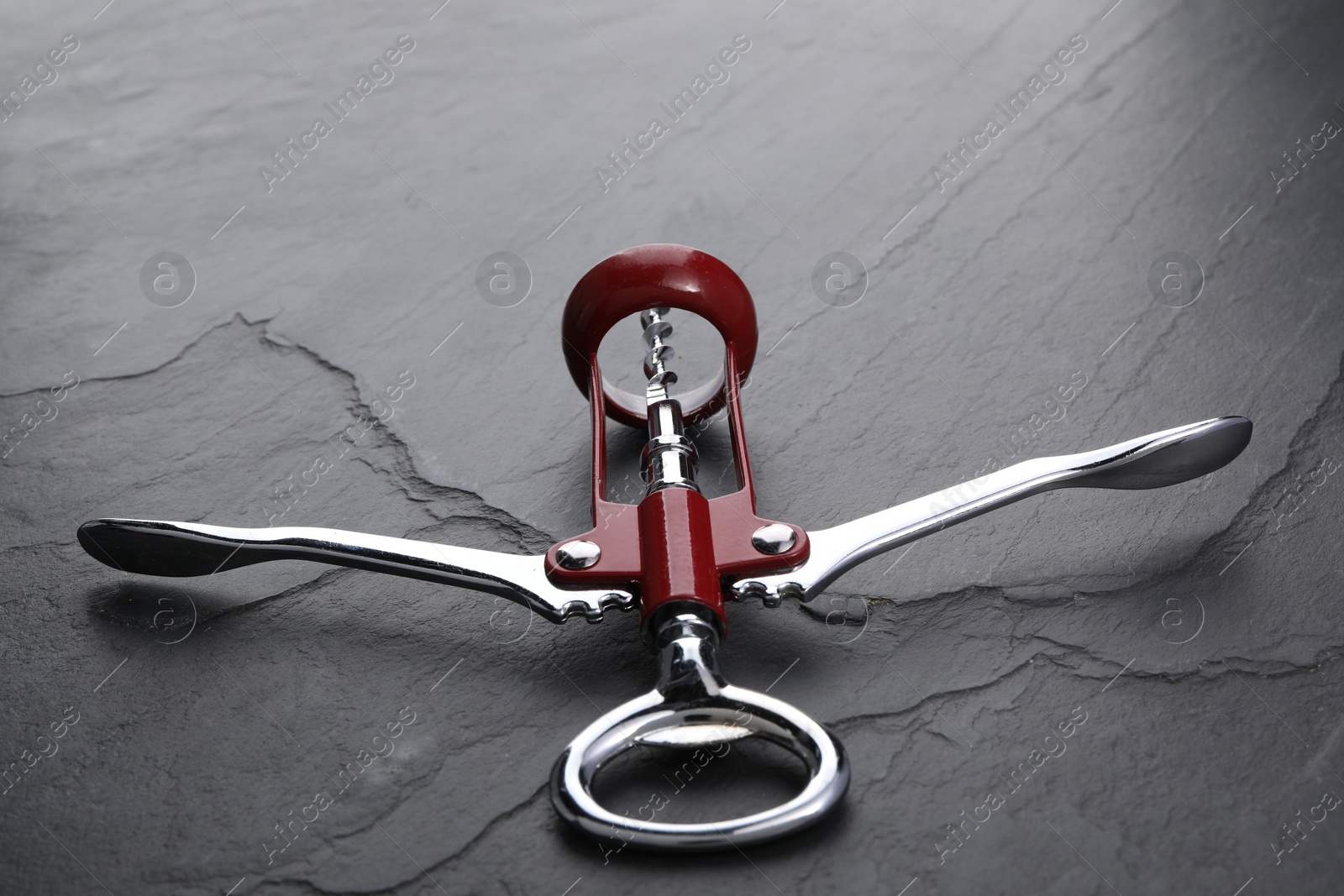 Photo of One wing corkscrew on grey textured table, closeup