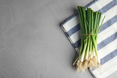 Fresh green onion on table, top view