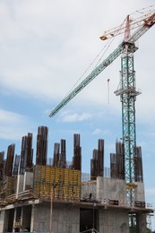 Photo of View of construction site with modern tower crane