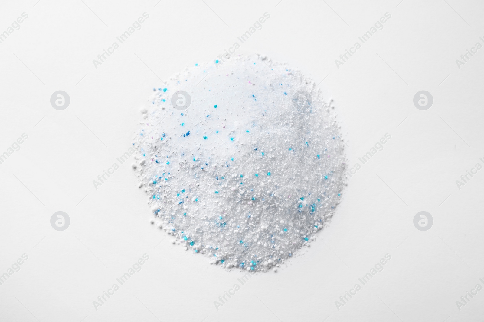 Photo of Pile of laundry powder isolated on white, top view