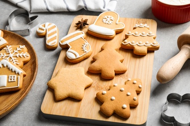 Tasty homemade Christmas cookies on grey table