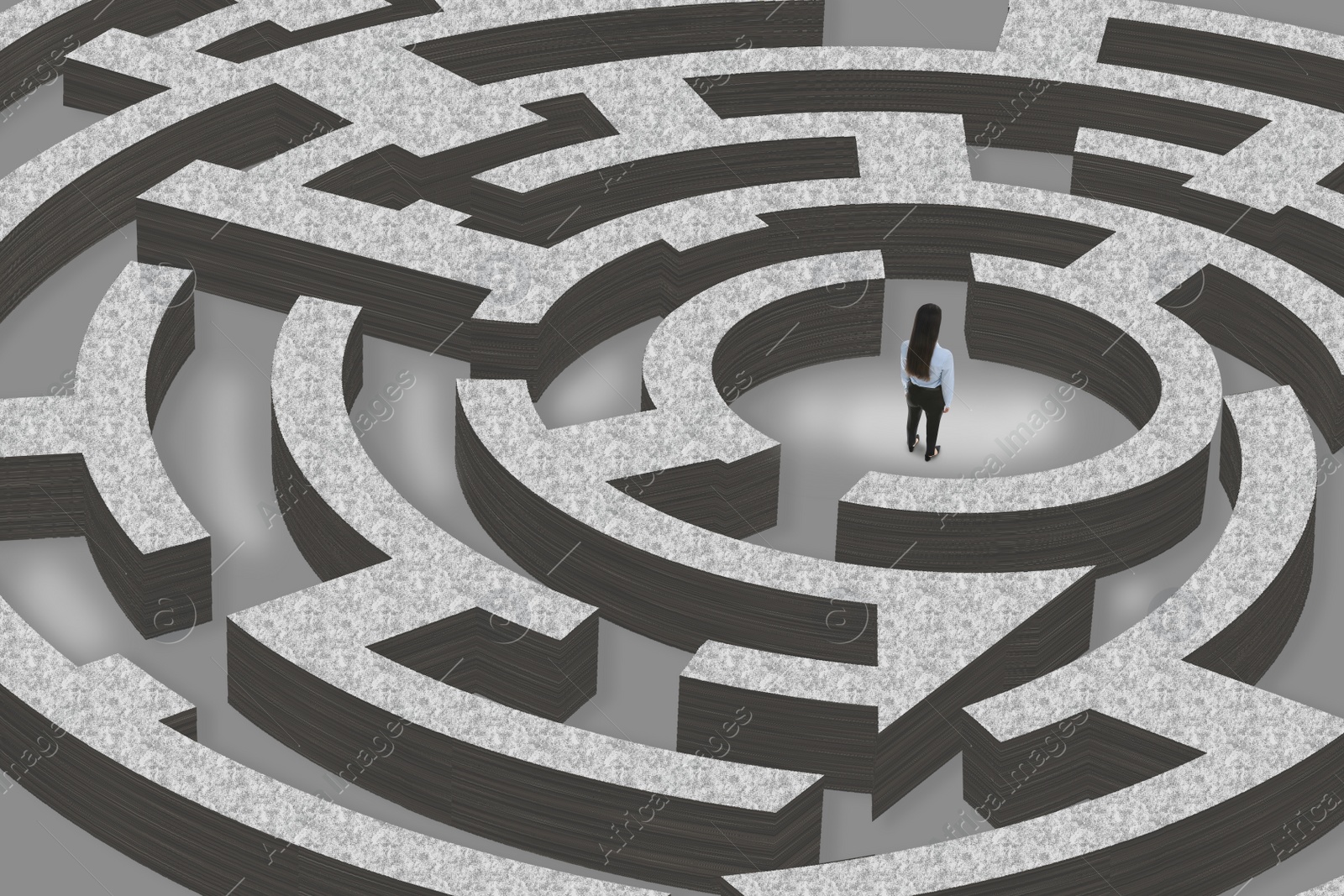 Image of Thoughtful businesswoman trying to find way out of maze