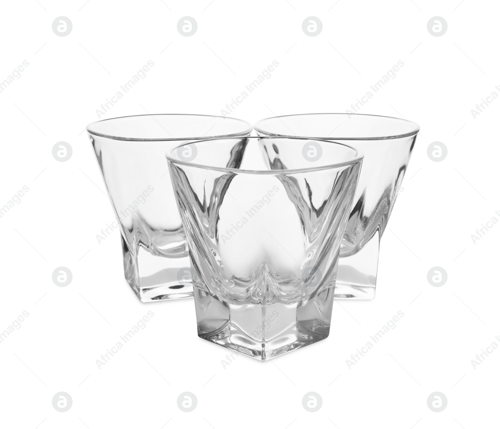 Photo of Elegant clean empty shot glasses isolated on white