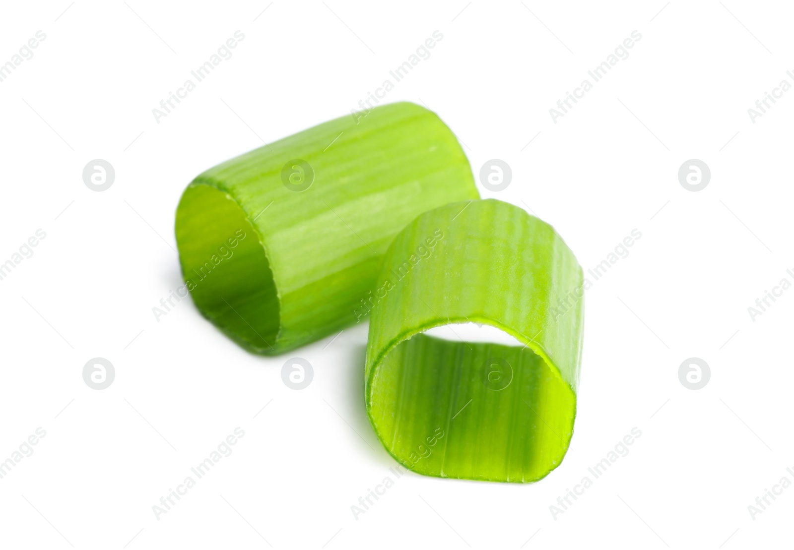 Photo of Pieces of fresh green onion on white background