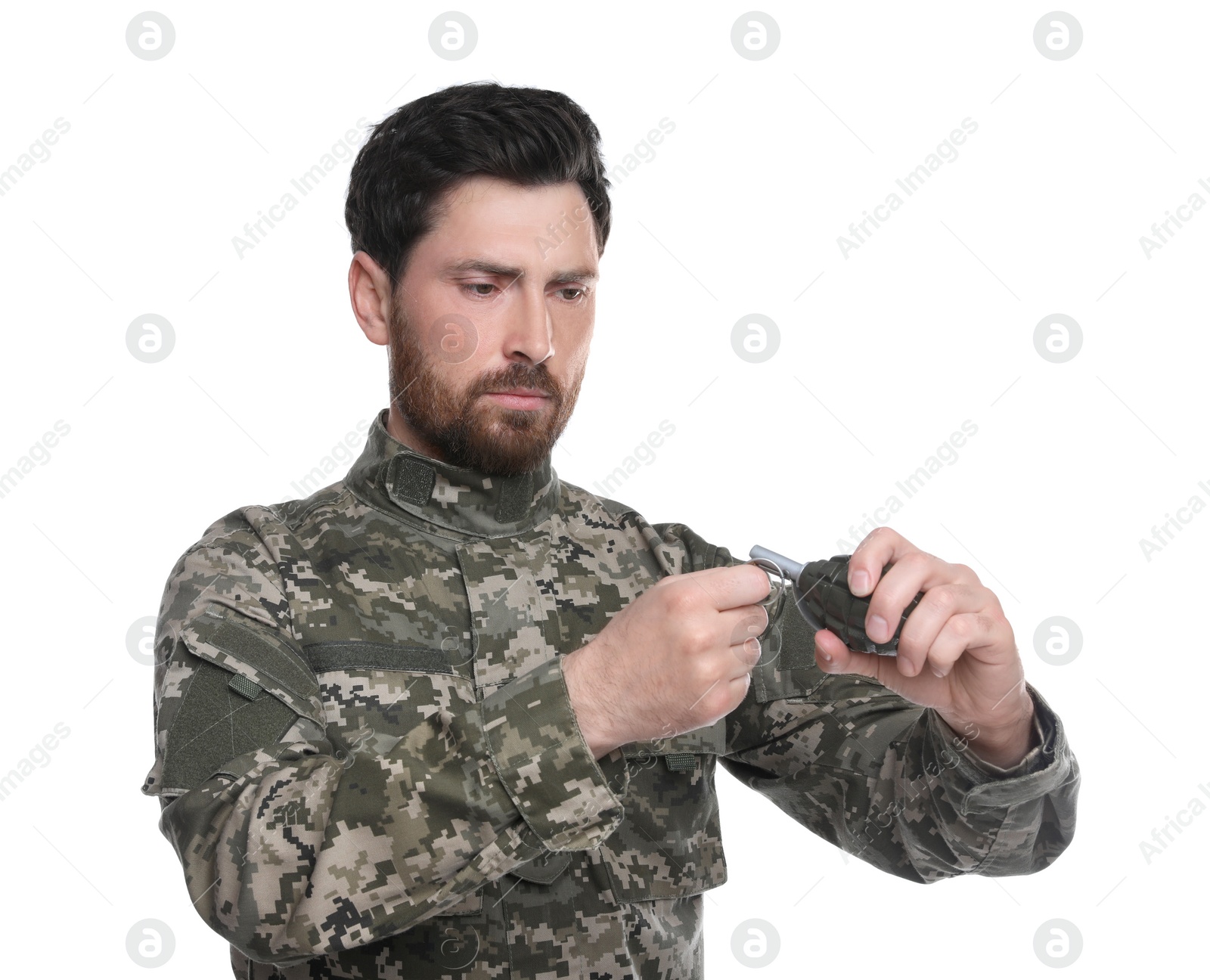 Photo of Soldier pulling safety pin out of hand grenade on white background. Military service