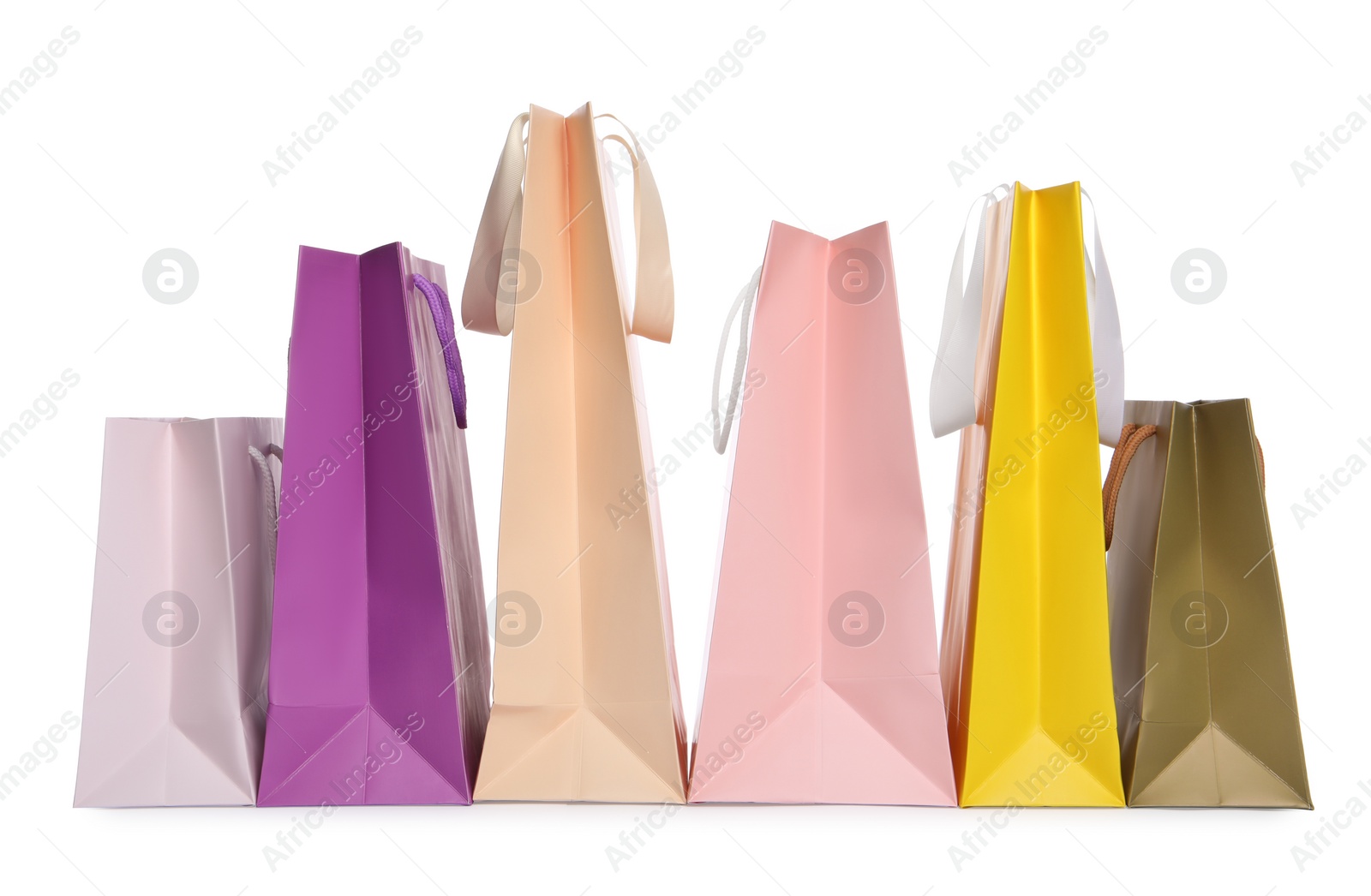 Photo of Colorful paper shopping bags isolated on white