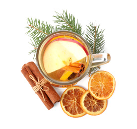 Photo of Aromatic mulled wine with cinnamon, dried orange and fir branch isolated on white, top view