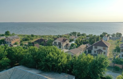 Beautiful view with cottage houses on river shore