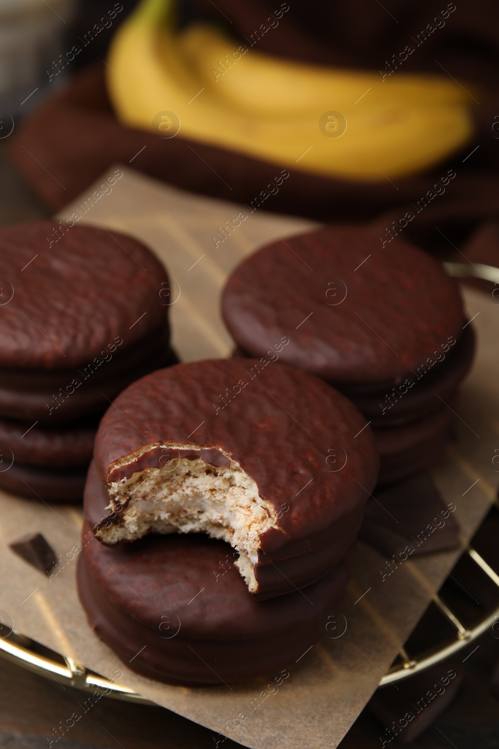 Photo of Delicious banana choco pies on table, closeup