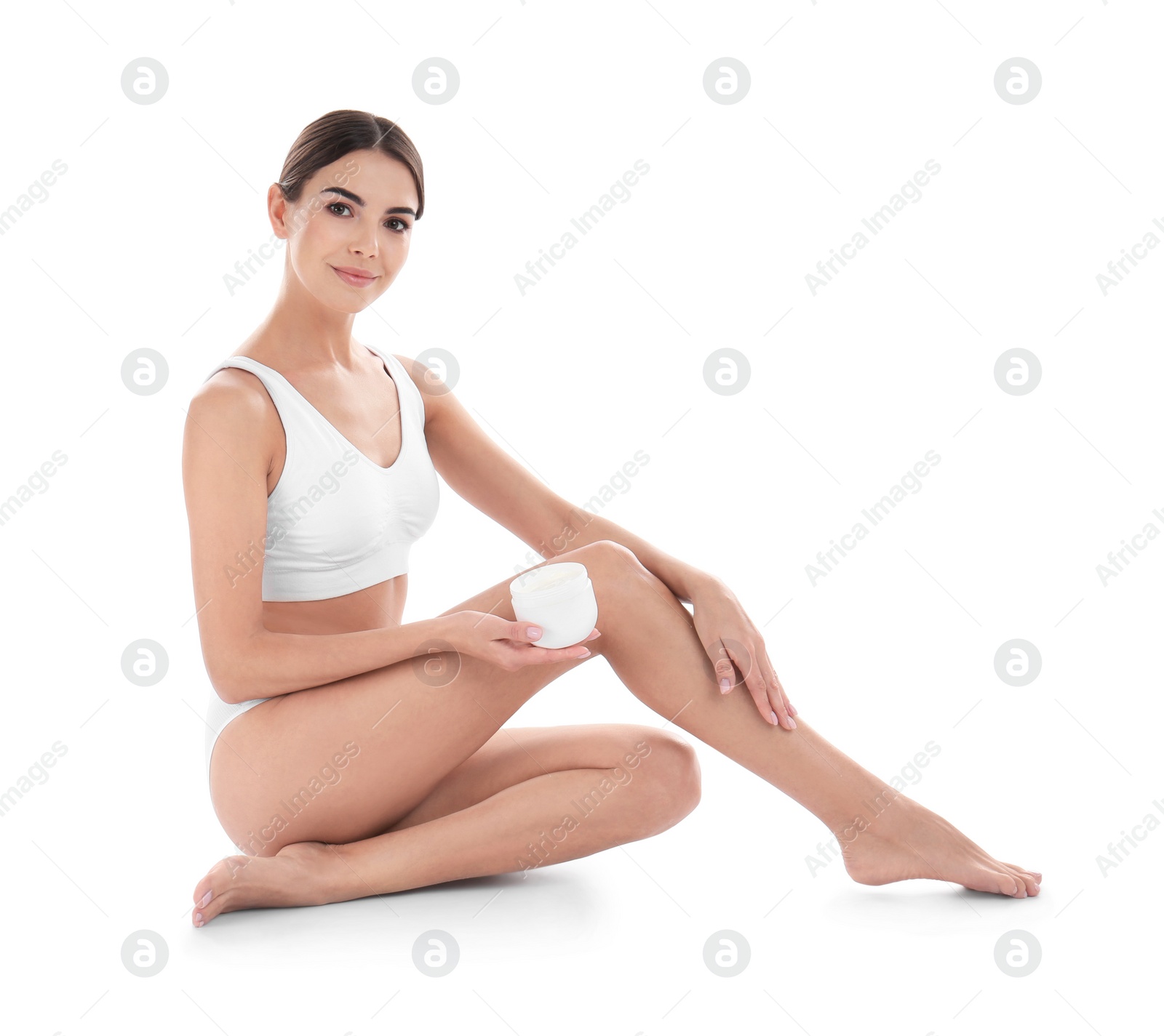 Photo of Young woman with jar of cream on white background. Beauty and body care