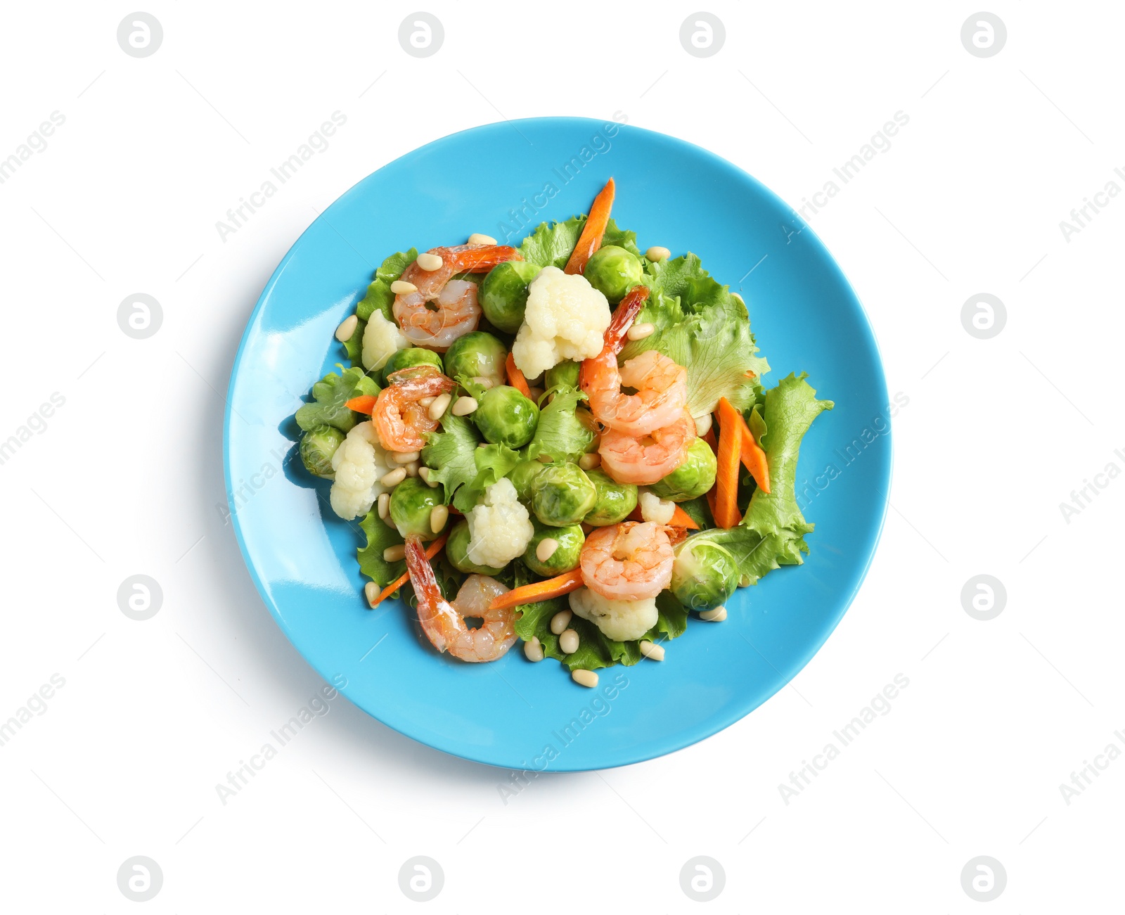 Photo of Plate of salad with Brussels sprouts isolated on white, top view