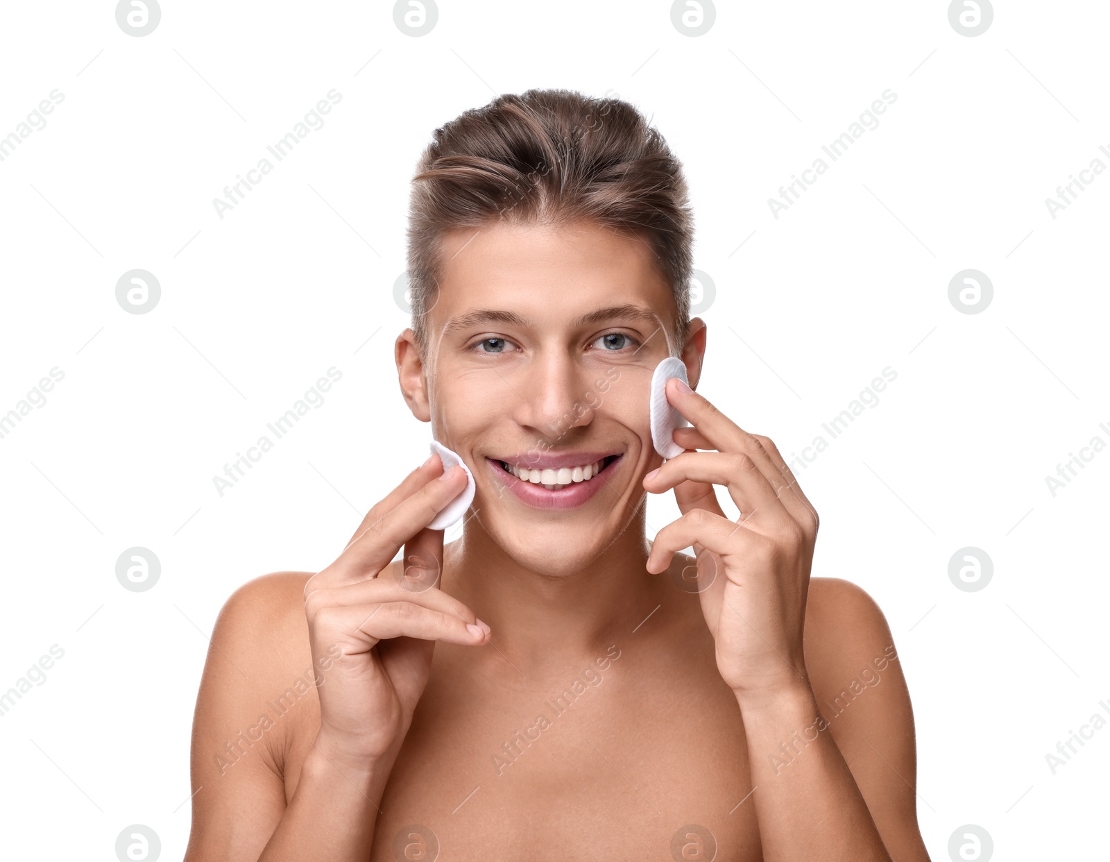 Photo of Handsome man with cotton pads on white background