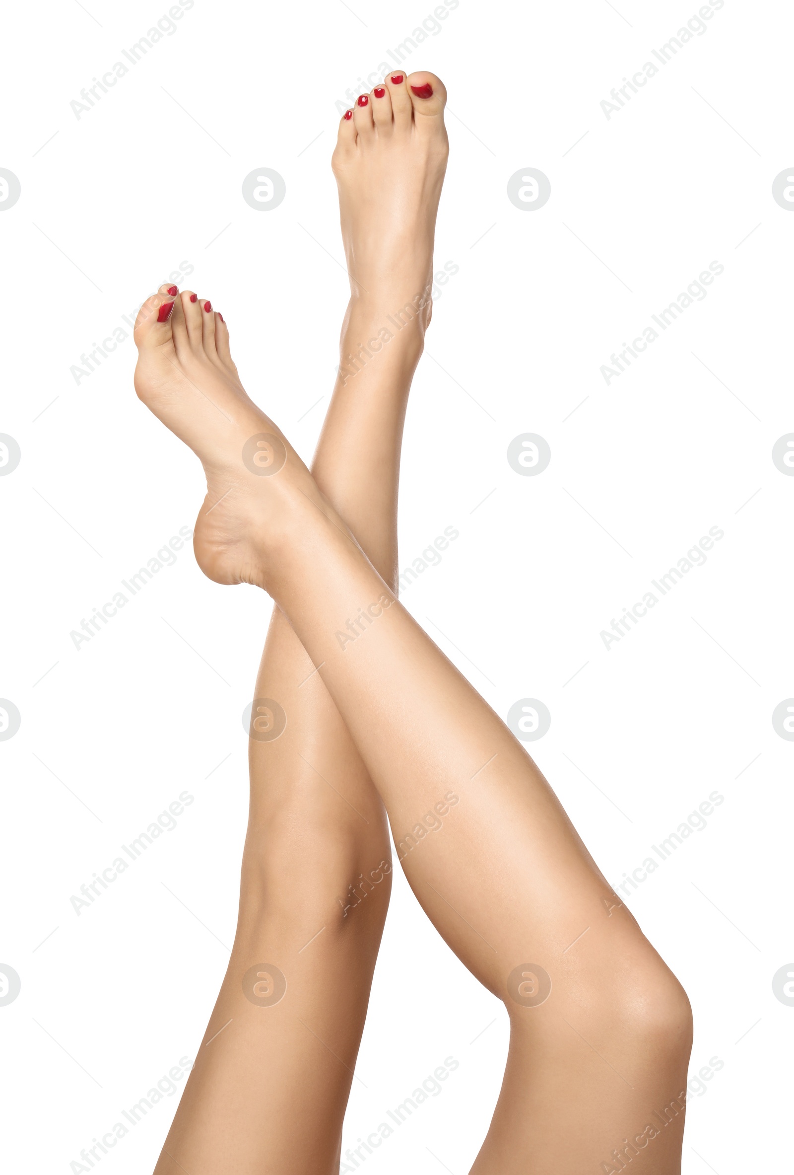 Photo of Woman with stylish red toenails after pedicure procedure isolated on white, closeup