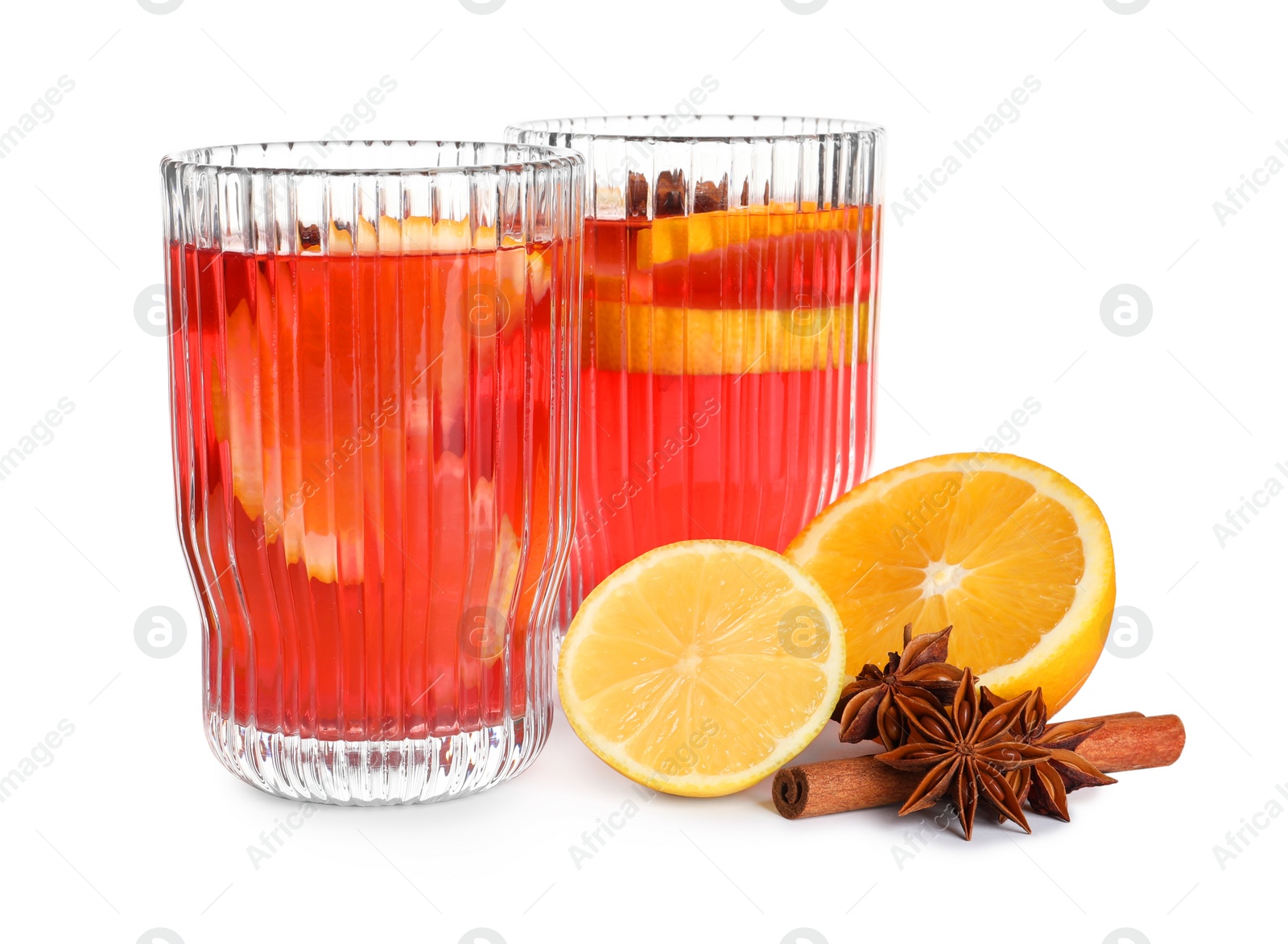 Photo of Aromatic punch drink and ingredients on white background