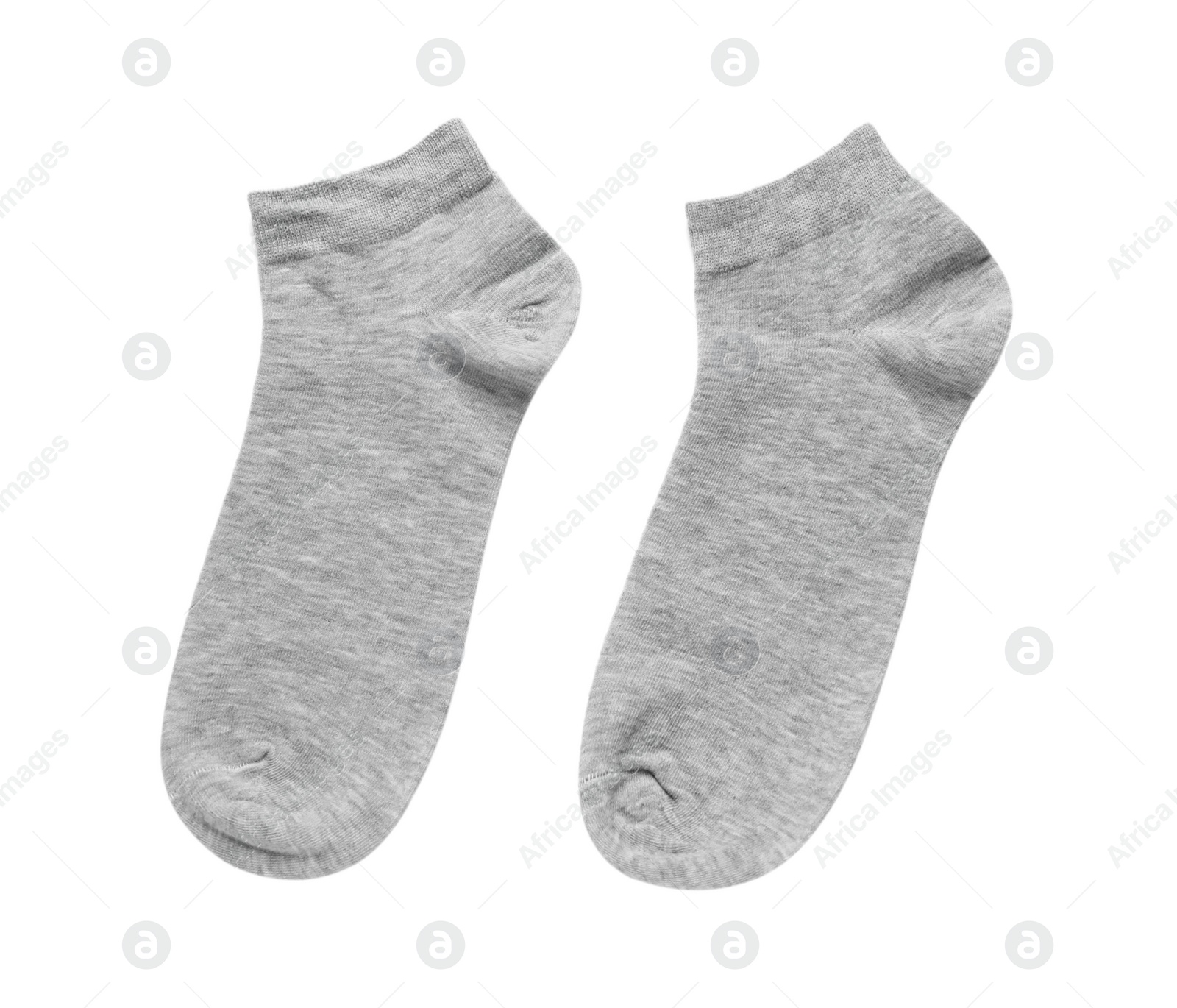 Photo of Pair of grey socks on white background, top view