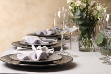 Photo of Stylish elegant table setting for festive dinner in restaurant