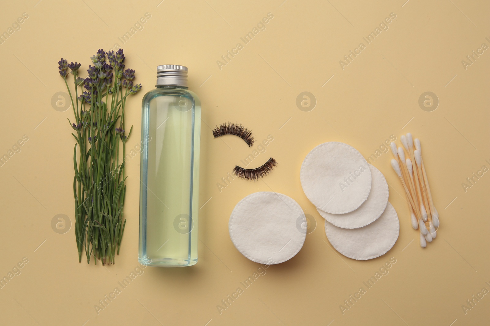 Photo of Flat lay composition with makeup remover and lavender on yellow background