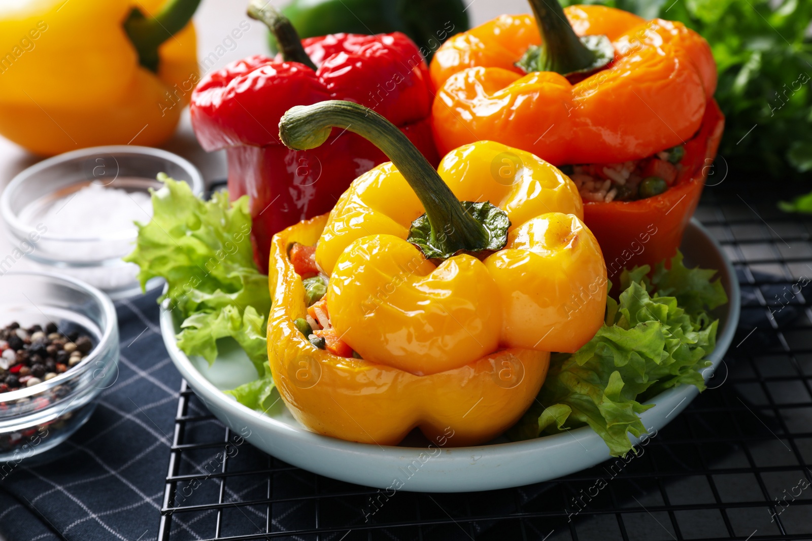 Photo of Tasty stuffed bell peppers on table, closeup