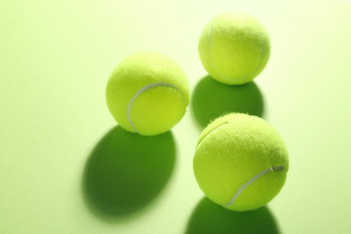 Photo of Tennis balls on green background. Sports equipment