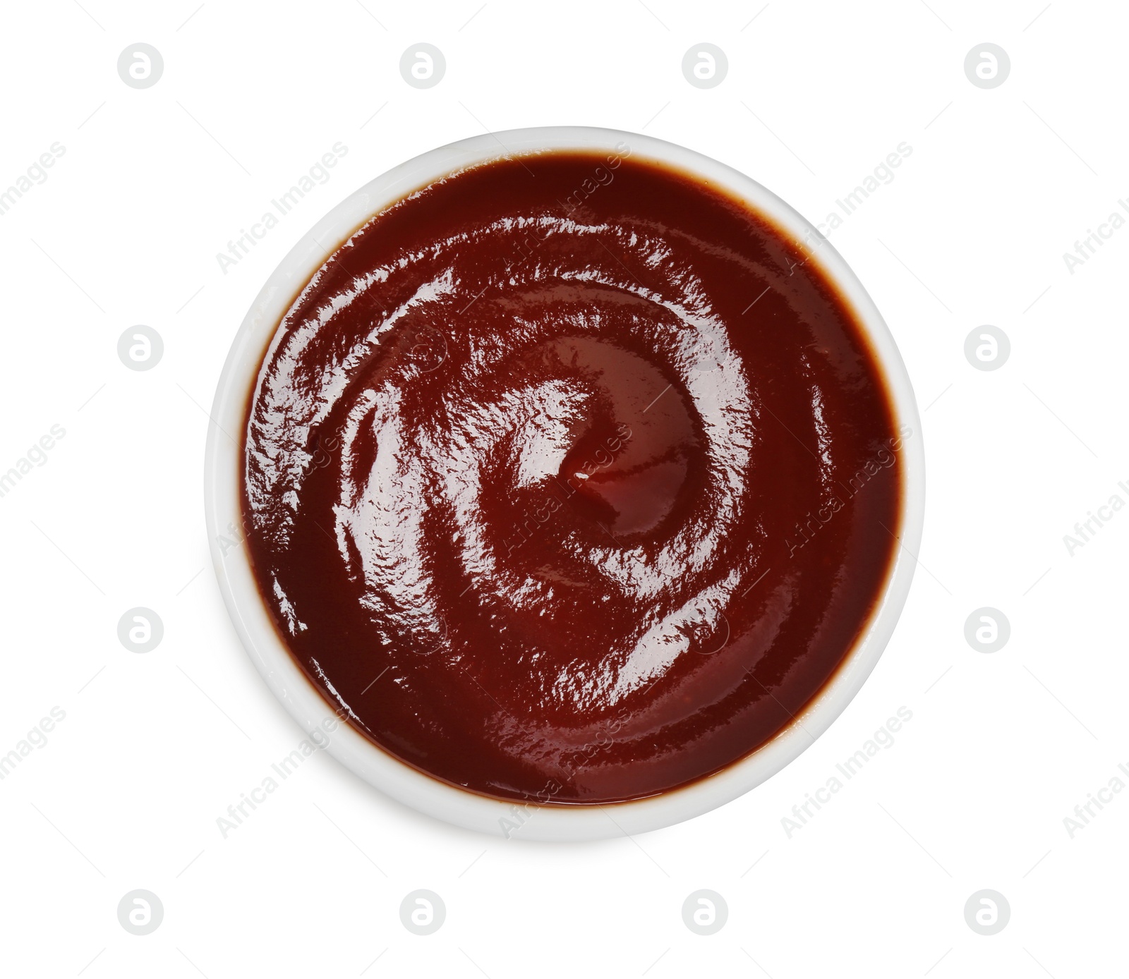 Photo of Tasty barbecue sauce in bowl isolated on white, top view