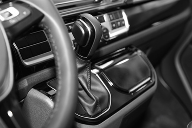 Photo of Gearshift and dashboard inside of modern car