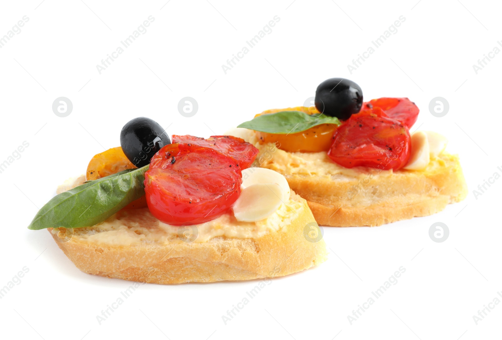 Photo of Delicious tomato bruschettas on white background. Traditional Italian antipasto