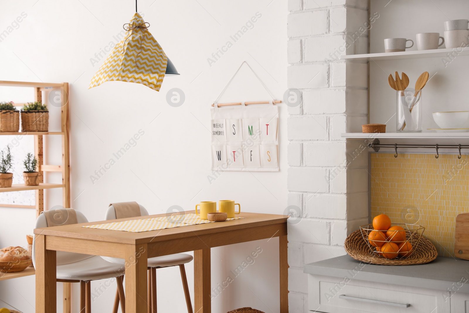 Photo of Modern kitchen interior with stylish wooden table