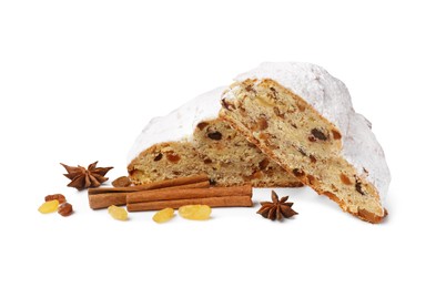 Photo of Cut delicious Stollen sprinkled with powdered sugar and ingredients on white background